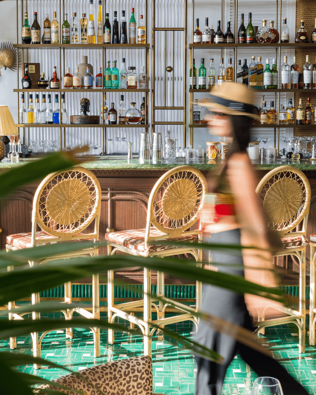 Elegant luxury restaurant bar with spirits and rattan chairs